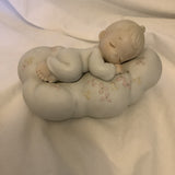 The Enesco Precious Moments Collection “Safe In The Arms Of Jesus” Figurine