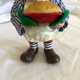 Man Holding Pie Figurine