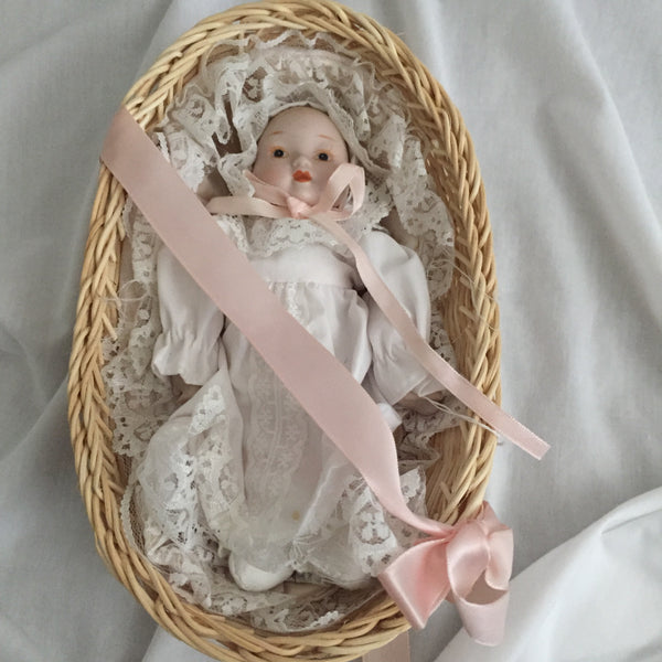 Porcelain Baby Inside a Basket